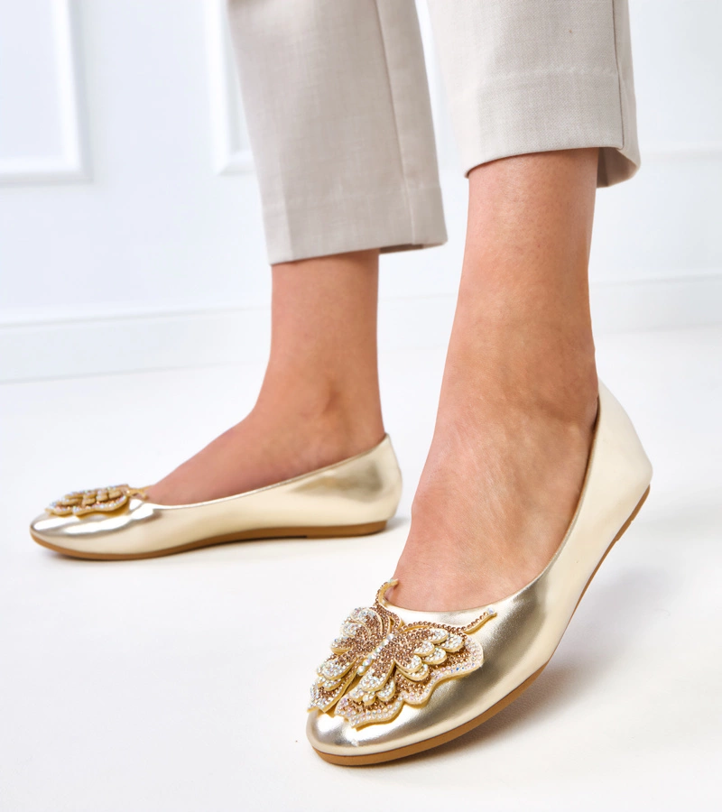 Goldene Ballerinas mit dekorativem Schmetterling Gruca